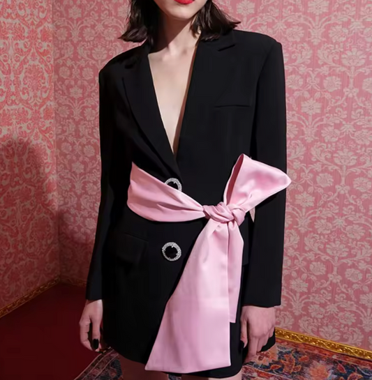 pink belted black blazer