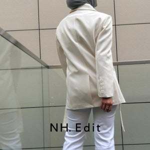 white blazer with horizontal belt